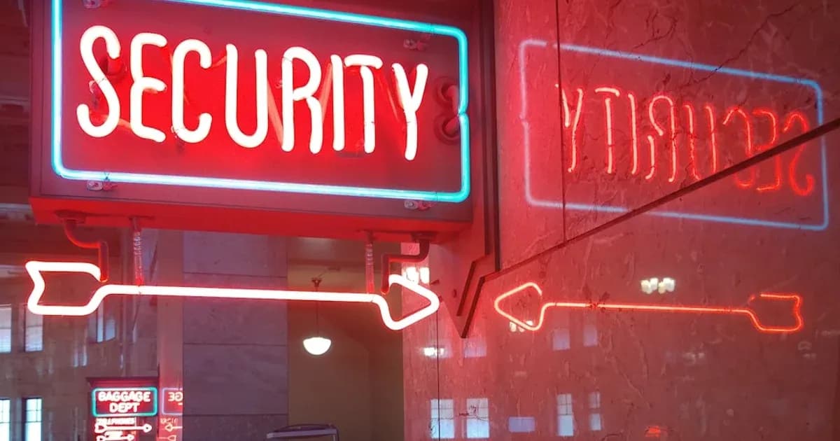a red security sign and a blue security sign