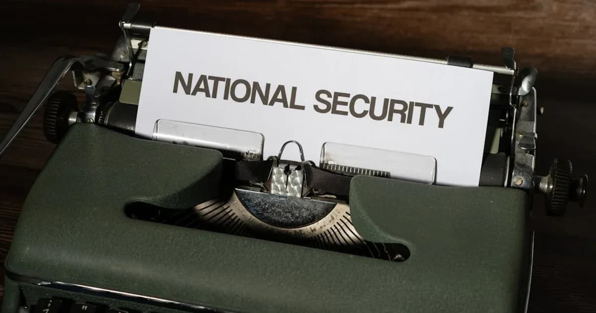 a close up of a typewriter with a national security sign on it