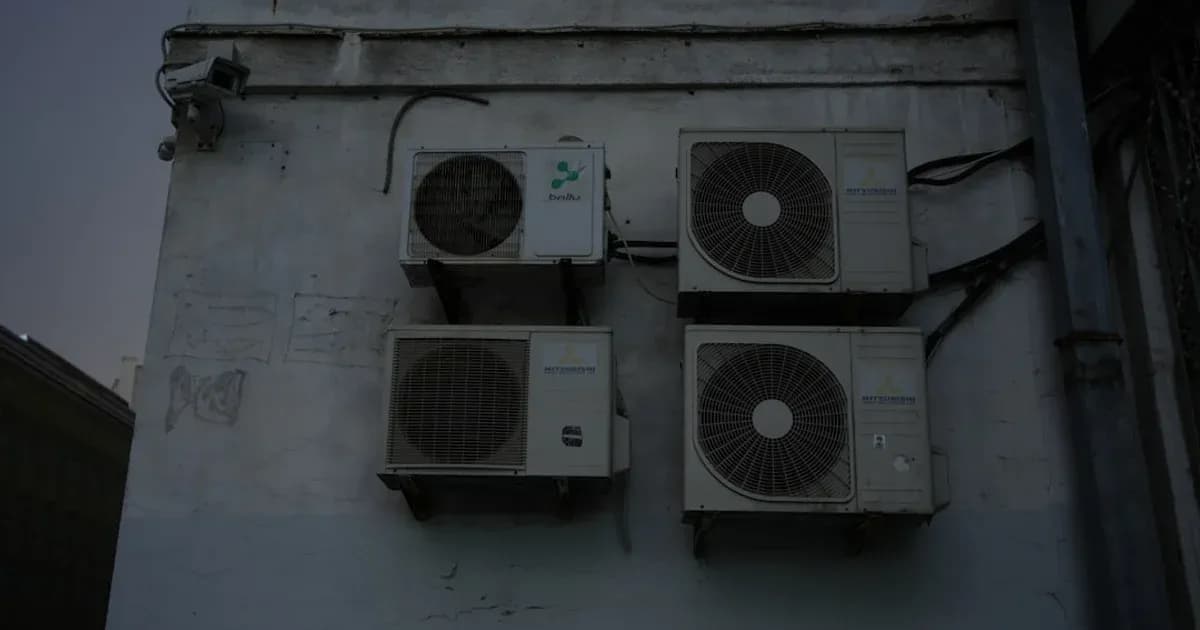 A group of speakers mounted to the side of a building