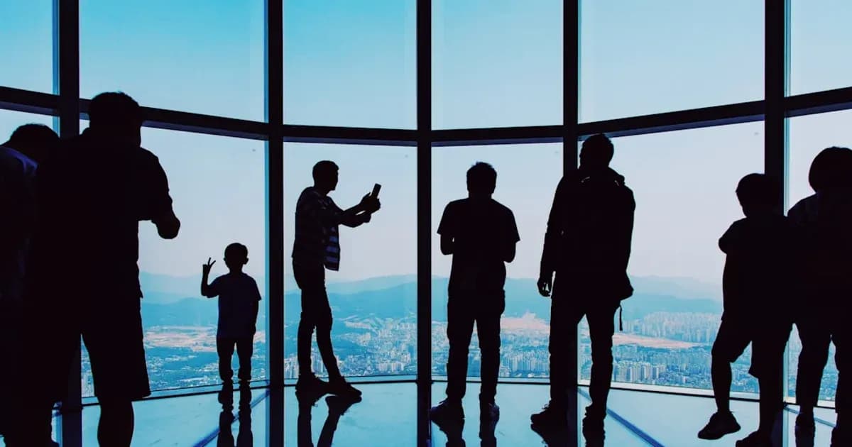 silhouette of people taking selfies