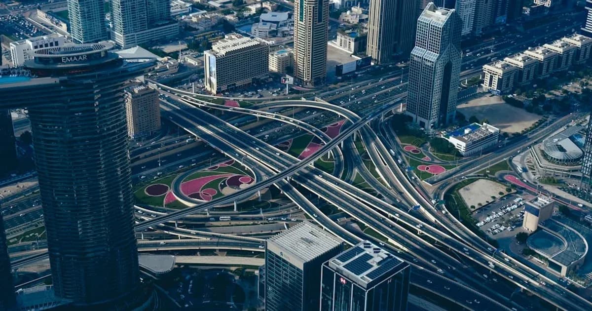 an aerial view of a highway intersection in a city