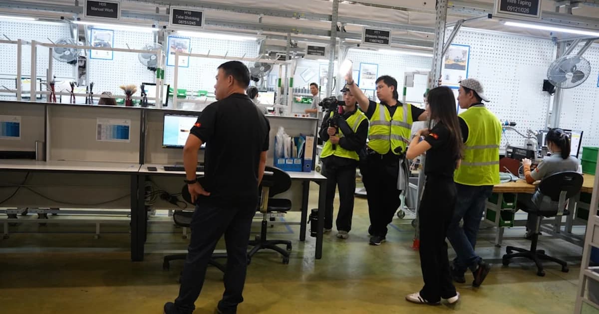 People in a modern office or factory setting