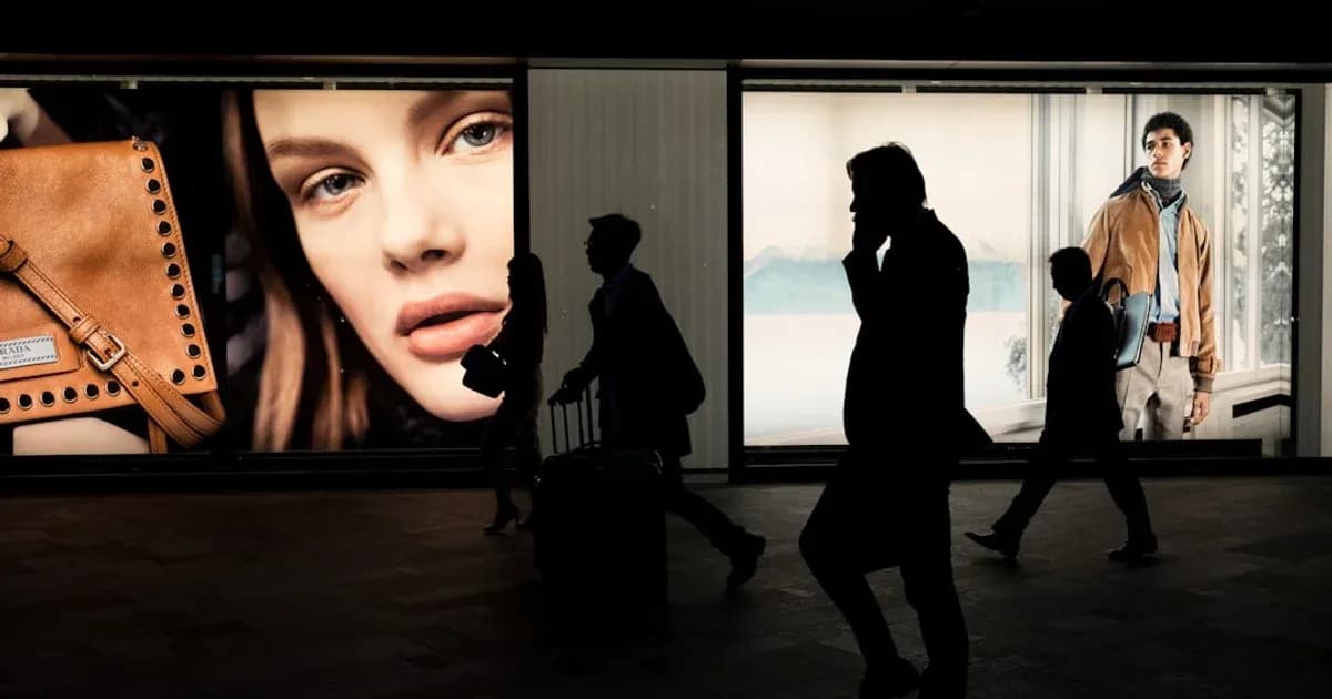 silhoutte of three persons near billboard